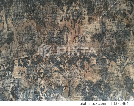 Wood surface with worn patterns and engravings from past use in a workshop or home setting during the day Wood surface with worn patterns and engravings from past use in a workshop or home setting during the day 138824643