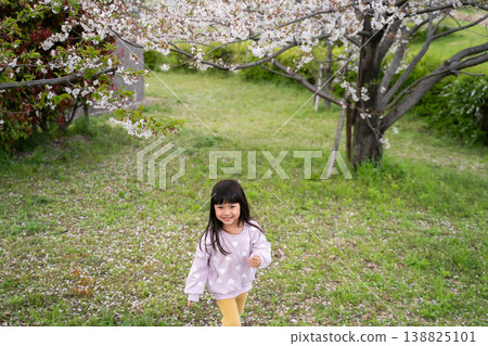 A girl walking with a smile in the park 138825101
