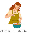 Contented woman in an apron add seasonings onto a fresh salad. Cooking scene featuring healthy food 138825349