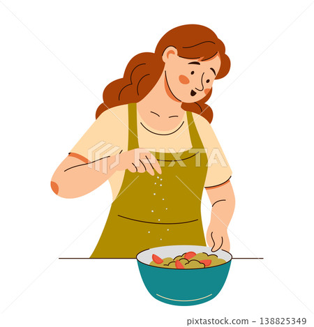 Contented woman in an apron add seasonings onto a fresh salad. Cooking scene featuring healthy food 138825349