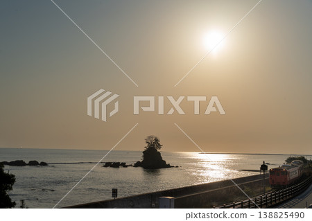 Railway tracks by the sea and the rising sun Railway tracks by the sea and the rising sun 138825490