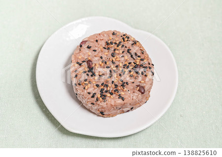 Rice balls with plenty of two kinds of sesame seeds in red bean rice Rice balls with plenty of two kinds of sesame seeds in red bean rice 138825610