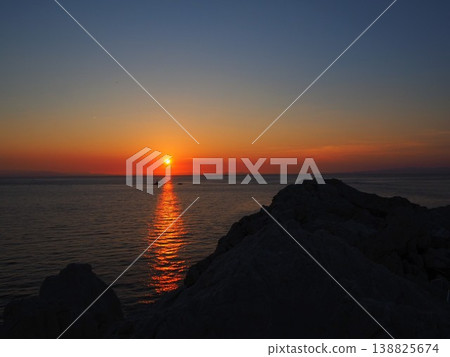 The sunset over Shirasaki Coast and the light reflected on the sea: A breathtaking view of Wakayama. The sunset over Shirasaki Coast and the light reflected on the sea: A breathtaking view of Wakayama. 138825674