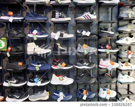 Yogyakarta, Indonesia - March 18th 2026 - Vibrant Energetic Display of Various Athletic Shoes on Shelves 138826287