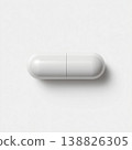 A simple white capsule image of a pharmaceutical product that stands out against a white background. Convenient for representing supplements and healthcare products. 138826305