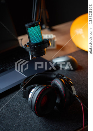 Microphone, headphones and laptop on desk in home recording studio 138828198