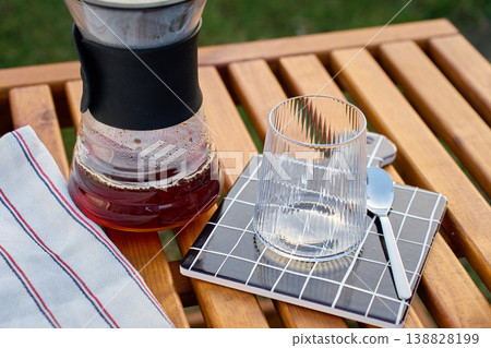 Specialty pour over coffee dripper setup with carafe outdoors Specialty pour over coffee dripper setup with carafe outdoors 138828199