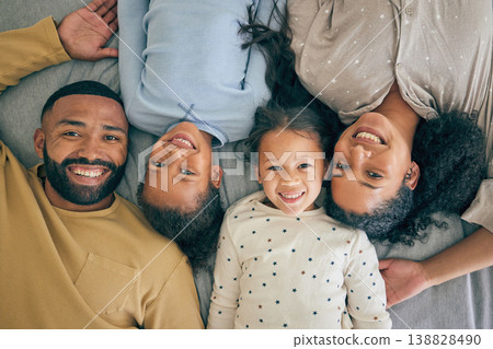 Happy family, bed and portrait of children relax or happy with parents together in the morning in a bedroom. Smile, dad and mom enjoy quality time with kids or girls with happiness, care and love Happy family, bed and portrait of children relax or happy with parents together in the morning in a bedroom. Smile, dad and mom enjoy quality time with kids or girls with happiness, care and love 138828490