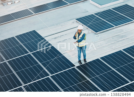 Rooftop phone call, solar panel and woman conversation about photovoltaic plate, renewable energy or project design. Roof top view, cellphone and female engineer inspection of power grid construction Rooftop phone call, solar panel and woman conversation about photovoltaic plate, renewable energy or project design. Roof top view, cellphone and female engineer inspection of power grid construction 138828494