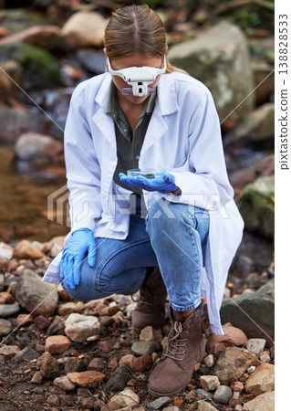 Research, rock and woman scientist test sample for inspection of the ecosystem, woods or environment study. Ecology, sustainable and professional environmentalist doing carbon footprint exam Research, rock and woman scientist test sample for inspection of the ecosystem, woods or environment study. Ecology, sustainable and professional environmentalist doing carbon footprint exam 138828533
