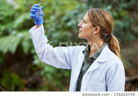 Woods, water and woman scientist test sample for research or inspection of the ecosystem and environment study. Science, sustainable and professional environmentalist doing carbon footprint exam Woods, water and woman scientist test sample for research or inspection of the ecosystem and environment study. Science, sustainable and professional environmentalist doing carbon footprint exam 138828549