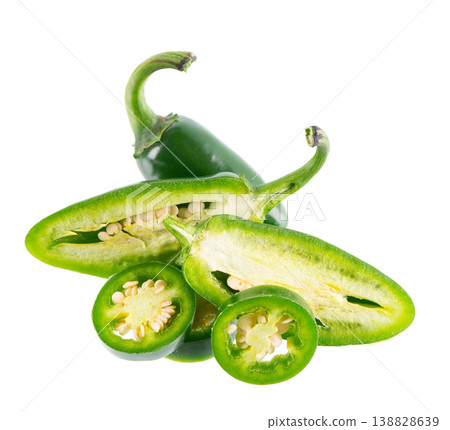 Fresh jalapeno pepper isolated on white background. Slices of green hot serrano pepper. Clipping path. Fresh jalapeno pepper isolated on white background. Slices of green hot serrano pepper. Clipping path. 138828639