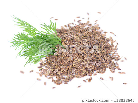 Dried dill seeds with a small bunch of fresh green dill isolated on white background. Dried dill seeds with a small bunch of fresh green dill isolated on white background. 138828645