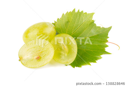 Green grape slices with fresh vine leaf and sprout isolated on white background. 138828646