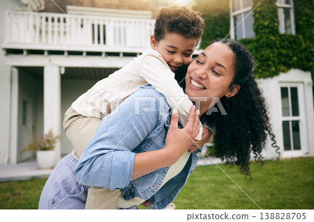 Mother, son and piggyback, hug outdoor with love and bonding, relax on lawn at holiday home with fun and happiness. Playful, smile and trust, woman and boy together in garden with vacation and nature 138828705
