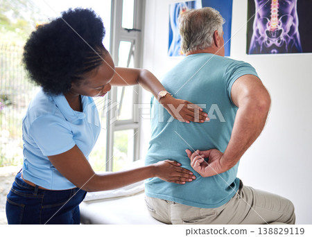 Physiotherapy, chiropractor and senior man with back pain or physiotherapist consulting a patient for muscle injury. Arthritis, physical and medical professional help elderly person with massage Physiotherapy, chiropractor and senior man with back pain or physiotherapist consulting a patient for muscle injury. Arthritis, physical and medical professional help elderly person with massage 138829119