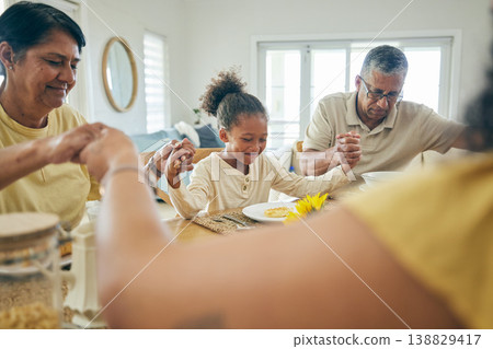Family, home and holding hands in prayer while eating at dinner table with grandparents, children and food. Happy people, kids and worship for praying thanks of meal, lunch and respect in dining room 138829417