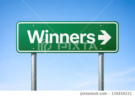 Green winners direction sign with arrow pointing right on clear sky background 138830331