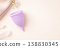 Purple menstrual cup on soft pastel background feminine hygiene concept 138830345