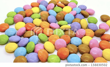 Chocolate dragees in multi-colored glaze 138830502