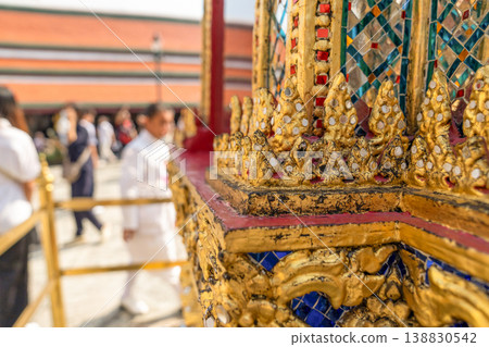 Close views show glass mosaic, gilded trim, and exterior ornament at Wat Phra Kaew. The details highlight temple craft and facade texture. Close views show glass mosaic, gilded trim, and exterior ornament at Wat Phra Kaew. The details highlight temple craft and facade texture. 138830542