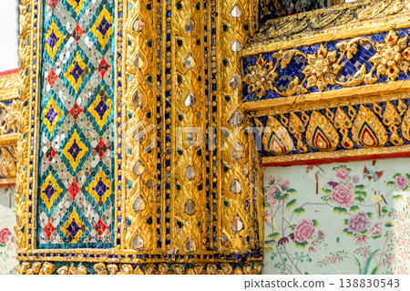 Close views show glass mosaic, gilded trim, and exterior ornament at Wat Phra Kaew. The details highlight temple craft and facade texture. Close views show glass mosaic, gilded trim, and exterior ornament at Wat Phra Kaew. The details highlight temple craft and facade texture. 138830543