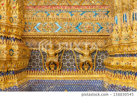 Close views show glass mosaic, gilded trim, and exterior ornament at Wat Phra Kaew. The details highlight temple craft and facade texture. Close views show glass mosaic, gilded trim, and exterior ornament at Wat Phra Kaew. The details highlight temple craft and facade texture. 138830545