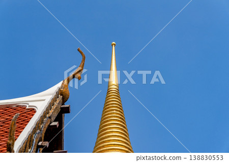 Close views show glass mosaic, gilded trim, and exterior ornament at Wat Phra Kaew. The details highlight temple craft and facade texture. Close views show glass mosaic, gilded trim, and exterior ornament at Wat Phra Kaew. The details highlight temple craft and facade texture. 138830553