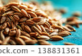 Close-up macro texture of brown cumin seeds on a vibrant teal surface 138831361