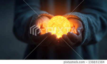 Holding a glowing sun orb in cupped hands, symbolizing hope and new beginnings Holding a glowing sun orb in cupped hands, symbolizing hope and new beginnings 138831384