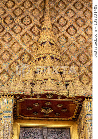 Patterned walls, frames, and roof edges create a rich study of Thai temple design. Repeated motifs and colors fill each close architectural view. Patterned walls, frames, and roof edges create a rich study of Thai temple design. Repeated motifs and colors fill each close architectural view. 138831408