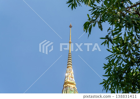 Patterned walls, frames, and roof edges create a rich study of Thai temple design. Repeated motifs and colors fill each close architectural view. Patterned walls, frames, and roof edges create a rich study of Thai temple design. Repeated motifs and colors fill each close architectural view. 138831411