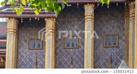 Patterned walls, frames, and roof edges create a rich study of Thai temple design. Repeated motifs and colors fill each close architectural view. Patterned walls, frames, and roof edges create a rich study of Thai temple design. Repeated motifs and colors fill each close architectural view. 138831413