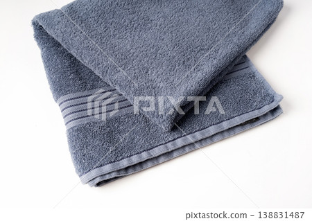 Folded bath towel isolated on white background Folded bath towel isolated on white background 138831487