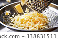 Close-up of grating hard cheese for cooking preparation 138831511