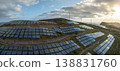 Solar energy panels photovoltaic cell and wind power plants on the seashore landscape for production of renewable green energy 138831760