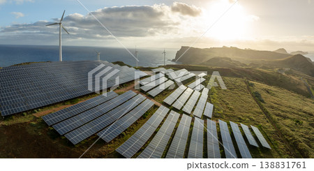 Solar energy panels photovoltaic cell and wind power plants on the seashore landscape for production of renewable green energy 138831761