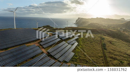 Solar energy panels photovoltaic cell and wind power plants on the seashore landscape for production of renewable green energy 138831762