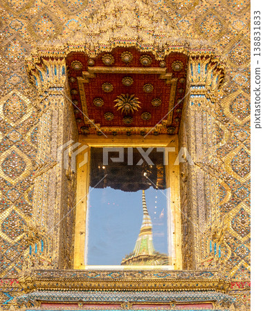 Sunlight catches mirror glass, painted surfaces, and gold edges across the temple exterior. Each close crop emphasizes texture, shine, and depth. 138831833