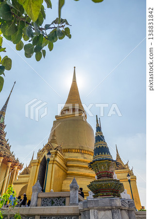 Sunlight catches mirror glass, painted surfaces, and gold edges across the temple exterior. Each close crop emphasizes texture, shine, and depth. Sunlight catches mirror glass, painted surfaces, and gold edges across the temple exterior. Each close crop emphasizes texture, shine, and depth. 138831842
