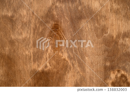 Natural wood texture background with organic grain patterns and a single dark knot, warm brown timber surface. 138832003