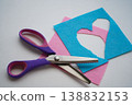 Scissors are placed on the pieces of felt. Needlework and sewing activities. 138832153