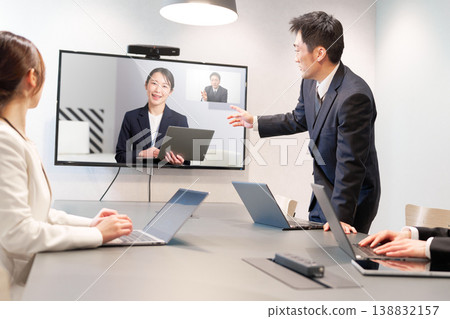 Company employees exchanging opinions in real time using a web conferencing system. Company employees exchanging opinions in real time using a web conferencing system. 138832157