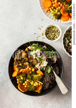 A balanced breakfast bowl with black quinoa, avocado, roast chicken, and sweet potatoes, topped with a fresh cabbage and radish salad A balanced breakfast bowl with black quinoa, avocado, roast chicken, and sweet potatoes, topped with a fresh cabbage and radish salad 138832843