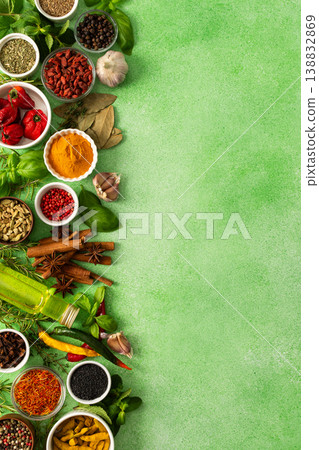 Fresh, fragrant spices and herbs arranged in an array of colors, sitting on a soft green backdrop, bringing flavor and zest to any kitchen, top view and copy space Fresh, fragrant spices and herbs arranged in an array of colors, sitting on a soft green backdrop, bringing flavor and zest to any kitchen, top view and copy space 138832869