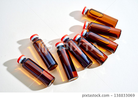 Medical vials containing amber liquid for healthcare research Medical vials containing amber liquid for healthcare research 138833069