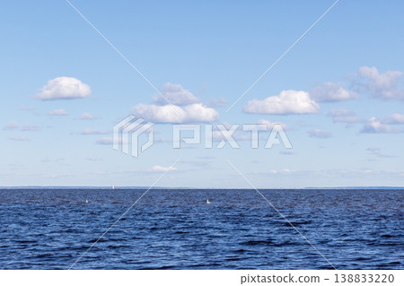 Calm blue Baltic sea stretches to a distant horizon Calm blue Baltic sea stretches to a distant horizon 138833220
