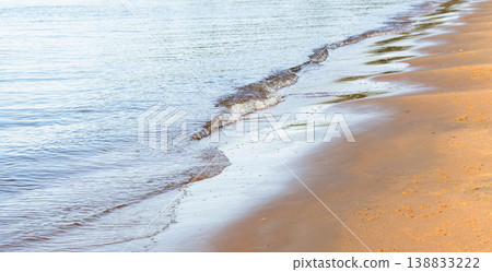 Tranquil sandy shoreline with gentle waves. Baltic sea coast Tranquil sandy shoreline with gentle waves. Baltic sea coast 138833222