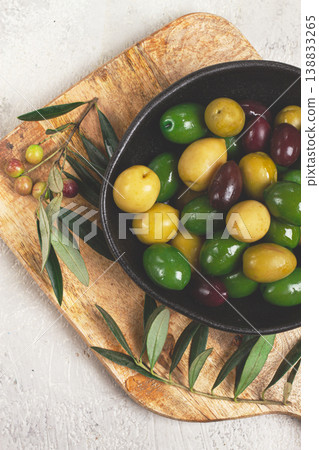 a mixture of olives, varieties of chalkidiki, Verdi giganti and Kalamata, in a bowl, top view, no people, 138833265