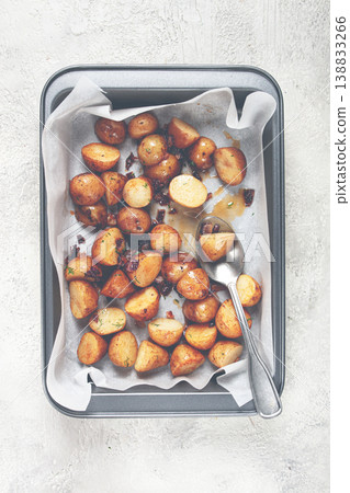 Roasted baby potatoes with herbs and spices on a baking tray ready to serve Roasted baby potatoes with herbs and spices on a baking tray ready to serve 138833266